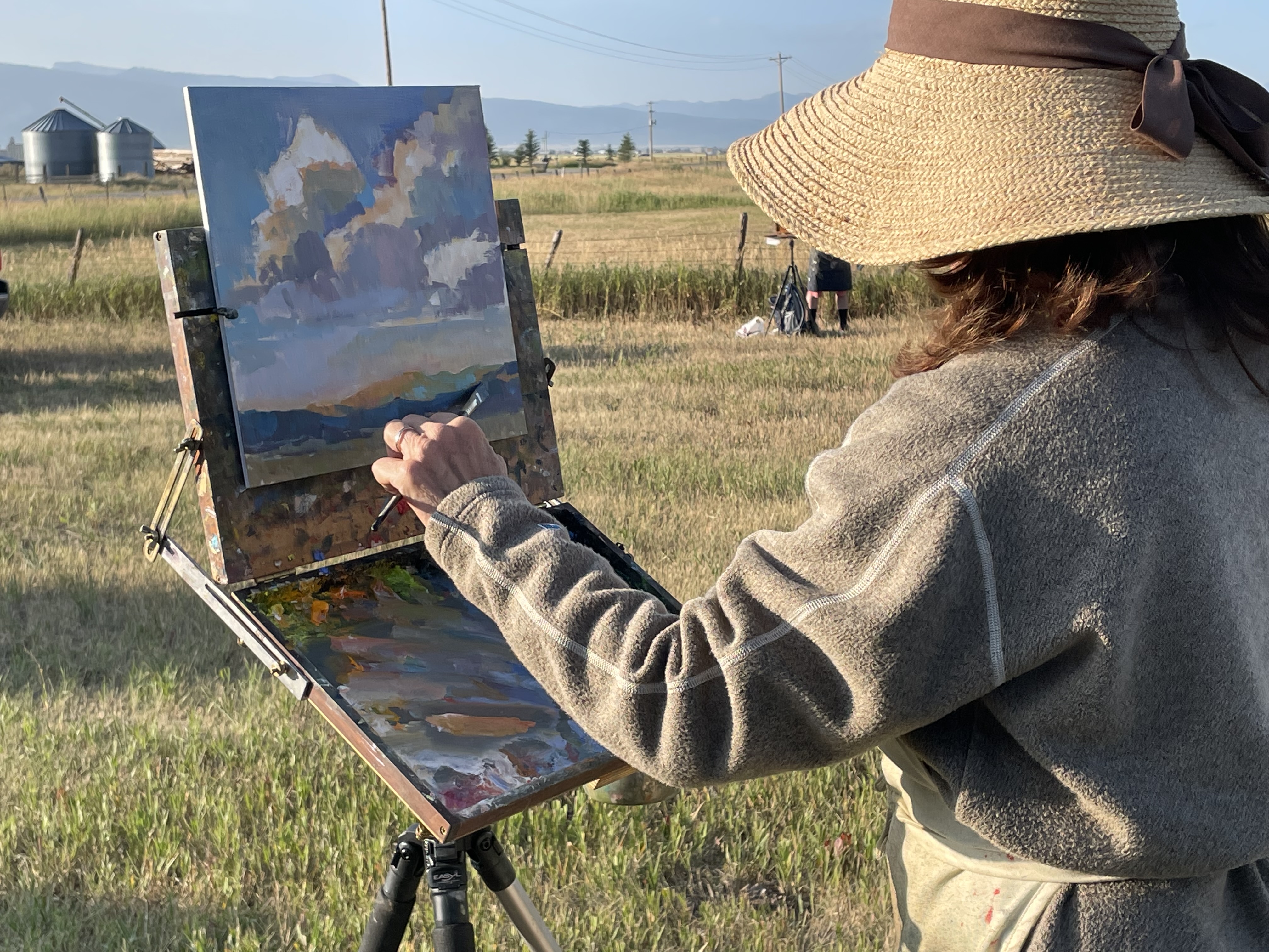 Woman painting in the Downtown Driggs Association Plein Air Festival in Driggs Idaho of Teton Valley Idaho