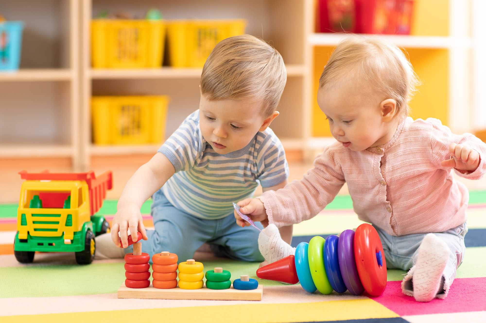 Two children playing with blocks at a daycare