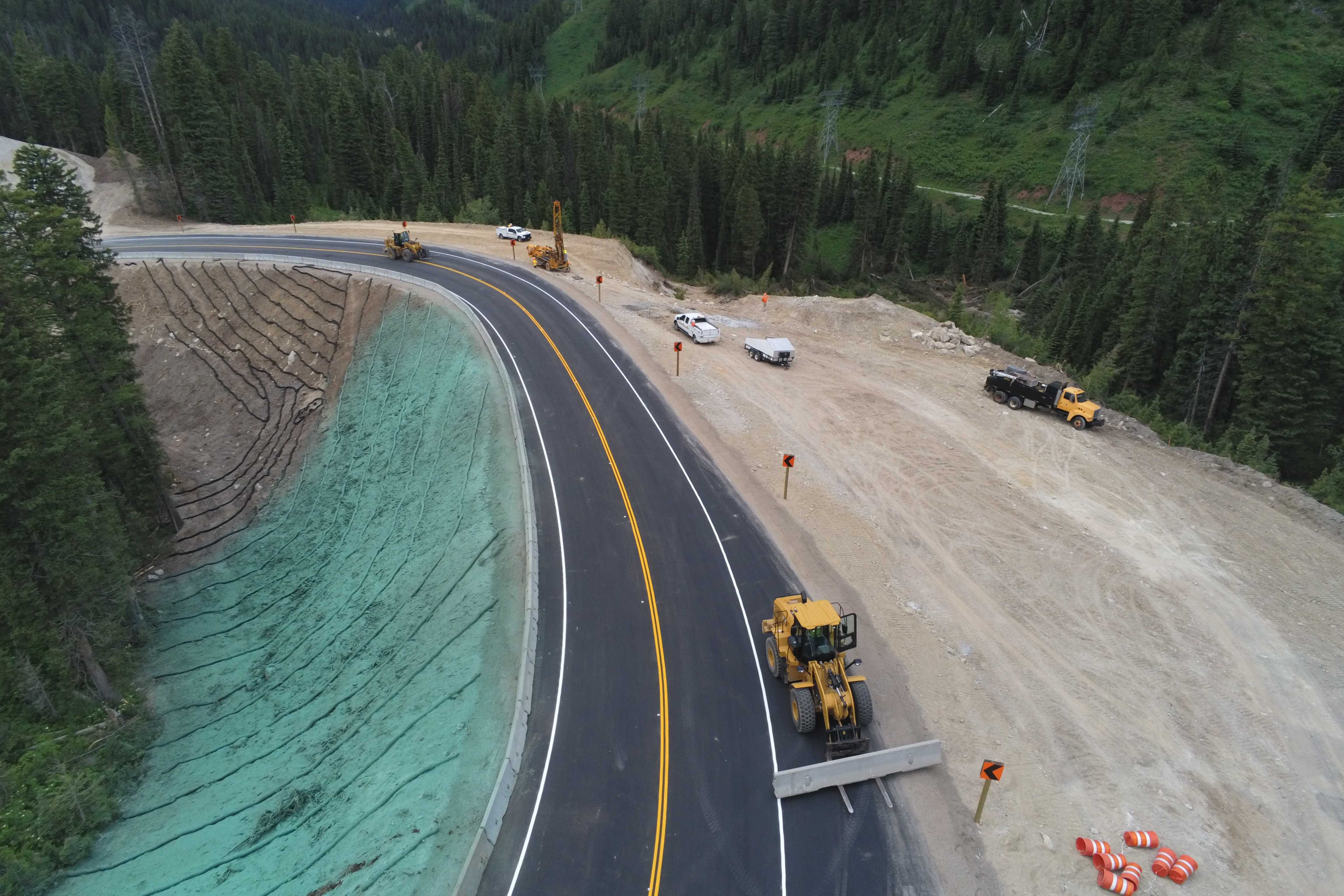 Teton Pass detour Open to traffic Friday June 28, 2024. Image of construction of roadway. 